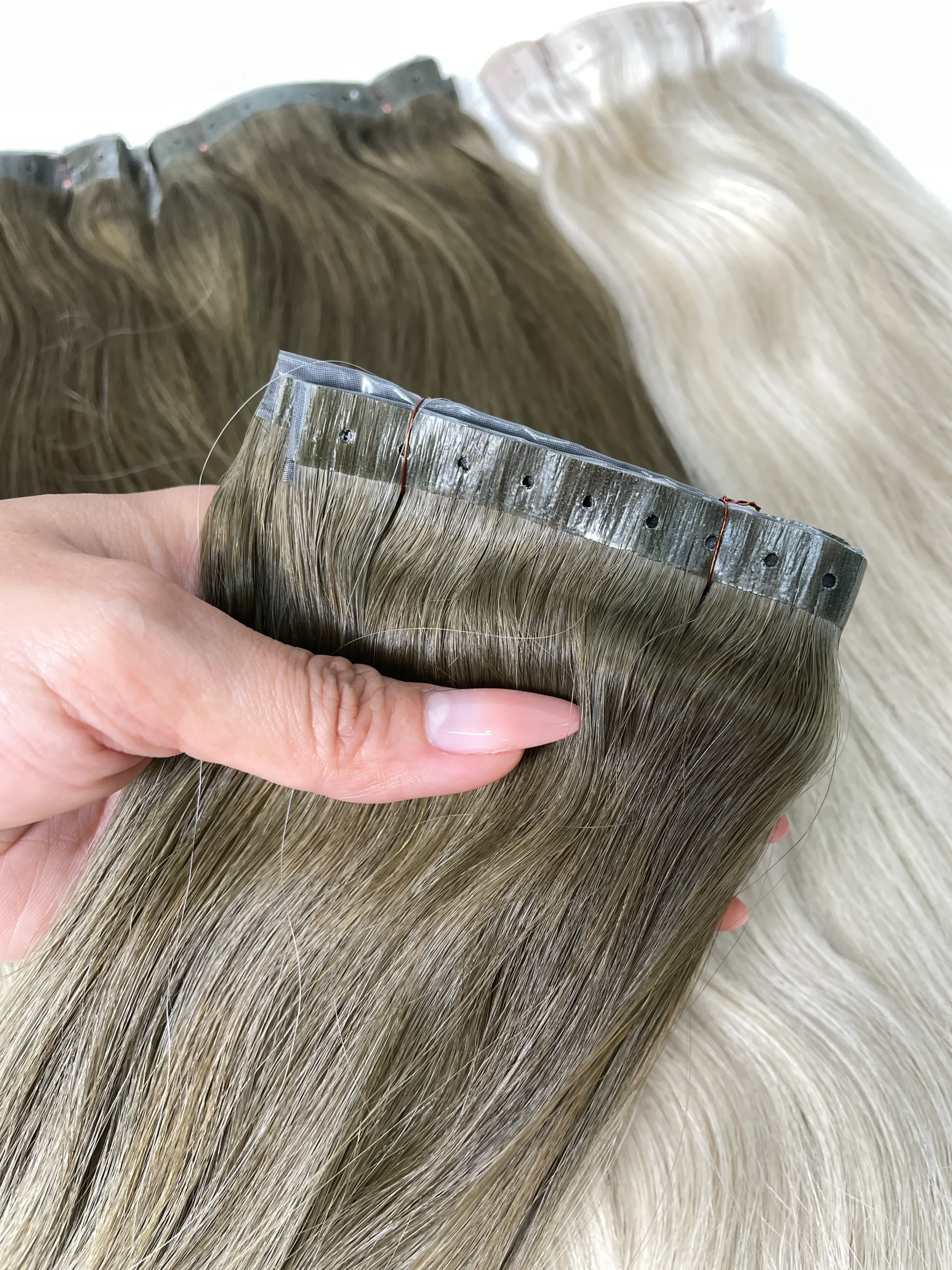 D’Amelio Weft silk PU base with pre-punched holes close-up by Unihairvn D’Amelio Weft silk PU base with pre-punched holes close-up by Unihairvn