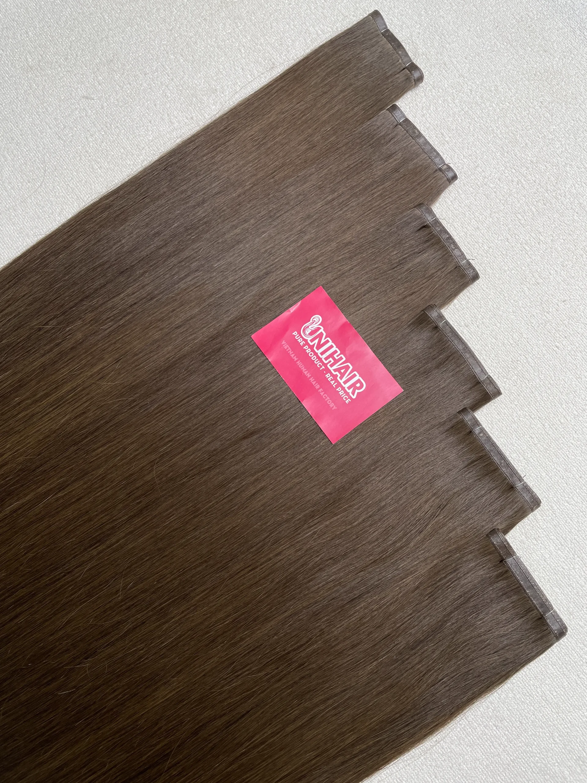 Flat Weft Vietnamese human hair bundle showing thin flexible weft profile Flat Weft Vietnamese human hair bundle showing thin flexible weft profile