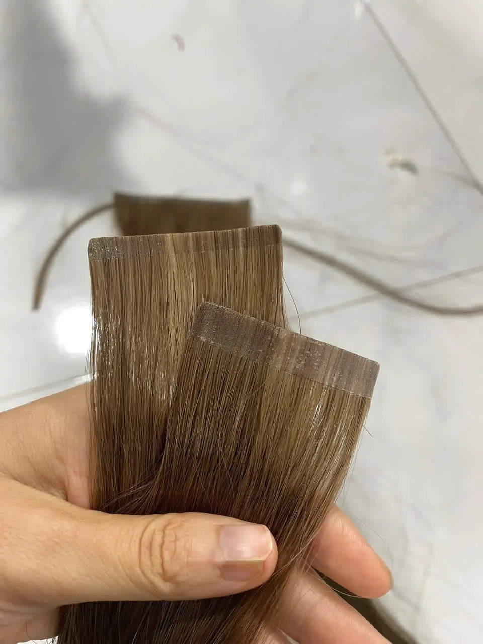 Tape-In Hair Extensions image 13 showing product gallery close-up by Unihairvn Vietnam hair factory Tape-In Hair Extensions image 13 showing product gallery close-up by Unihairvn Vietnam hair factory