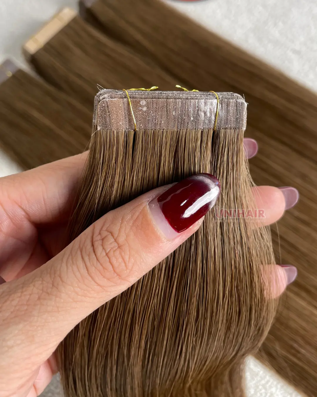 Fabric Tape-In Hair Extensions close-up showing soft textile backing and secure tape tab