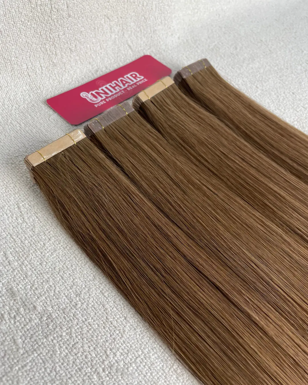 Fabric Tape-In Hair Extensions detail image showing reusable tape-in hair and backing profile