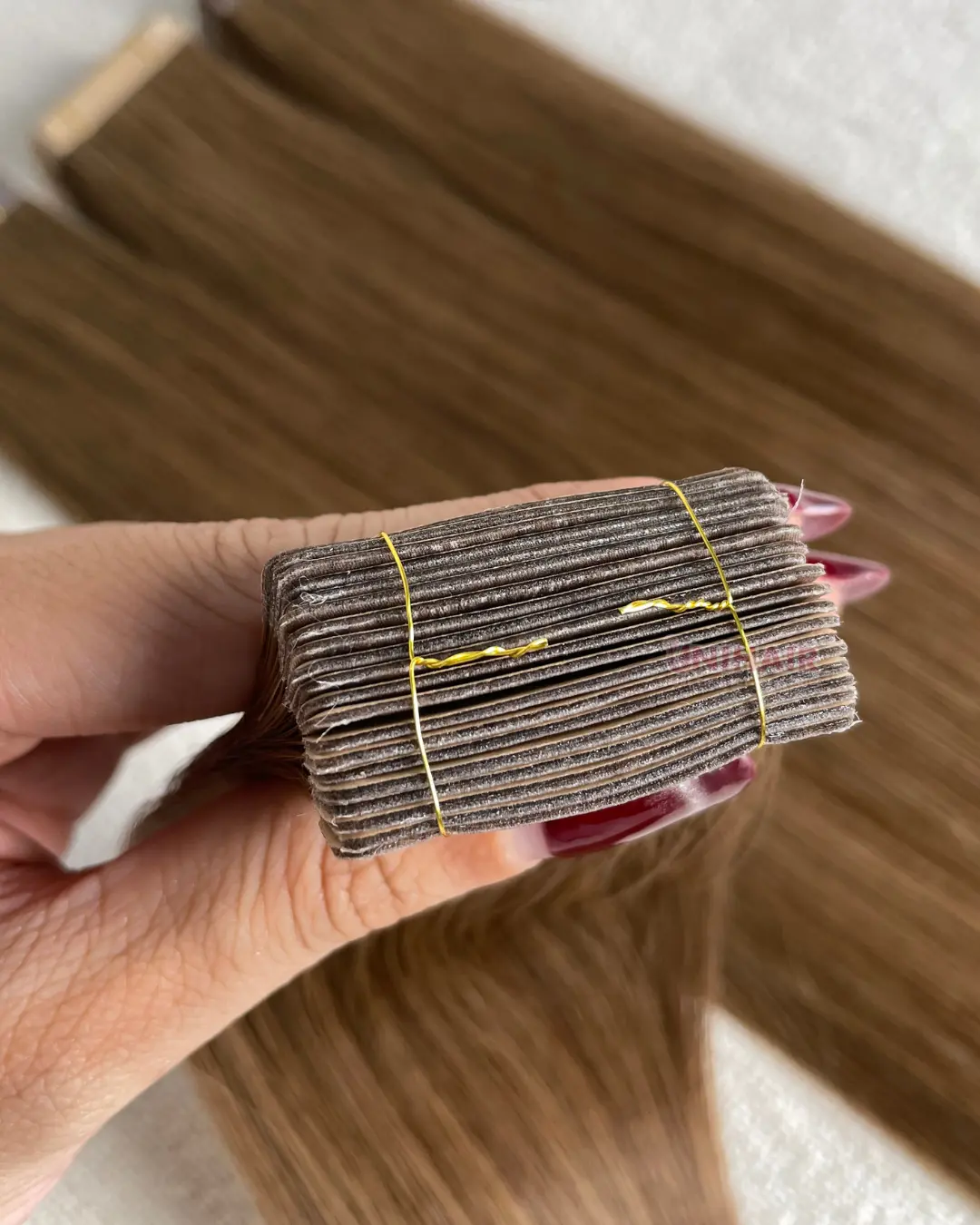 Fabric Tape-In Hair Extensions product visual showing textile-backed tabs and Vietnamese human hair
