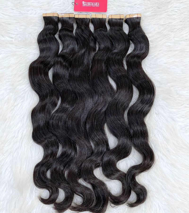 Natural Wavy Tape In Extensions – Soft, Reusable and Raw Vietnamese Hair 4 Natural Wavy Tape In Extensions – Soft, Reusable and Raw Vietnamese Hair - Image 4